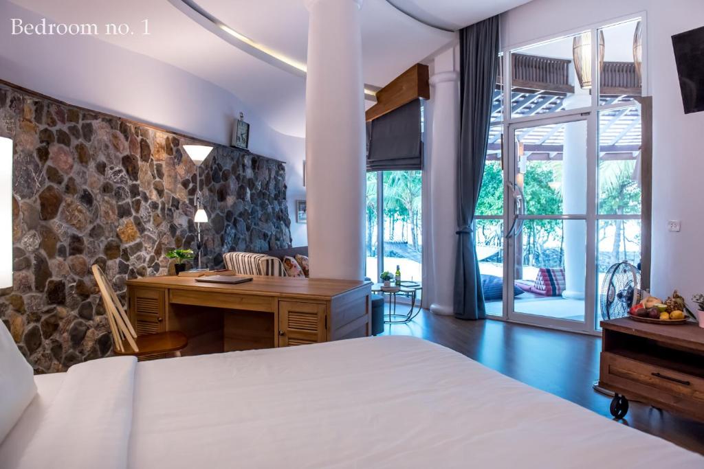 Postel nebo postele na pokoji v ubytování Koh Mak Cococape Resort