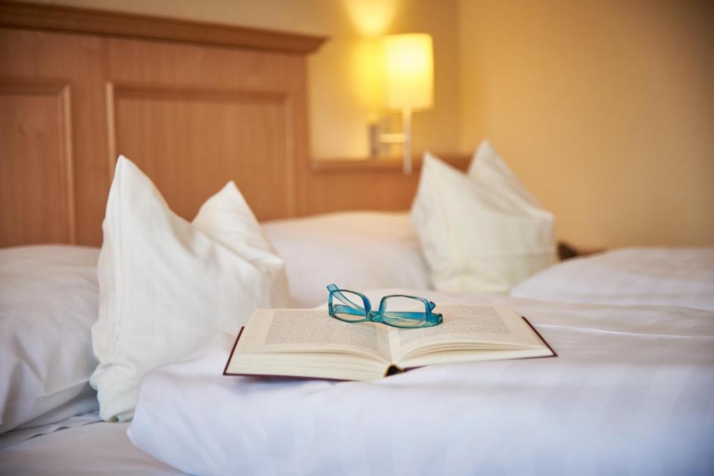 Postel nebo postele na pokoji v ubytování Apparthotel Minerva Diana Octavia