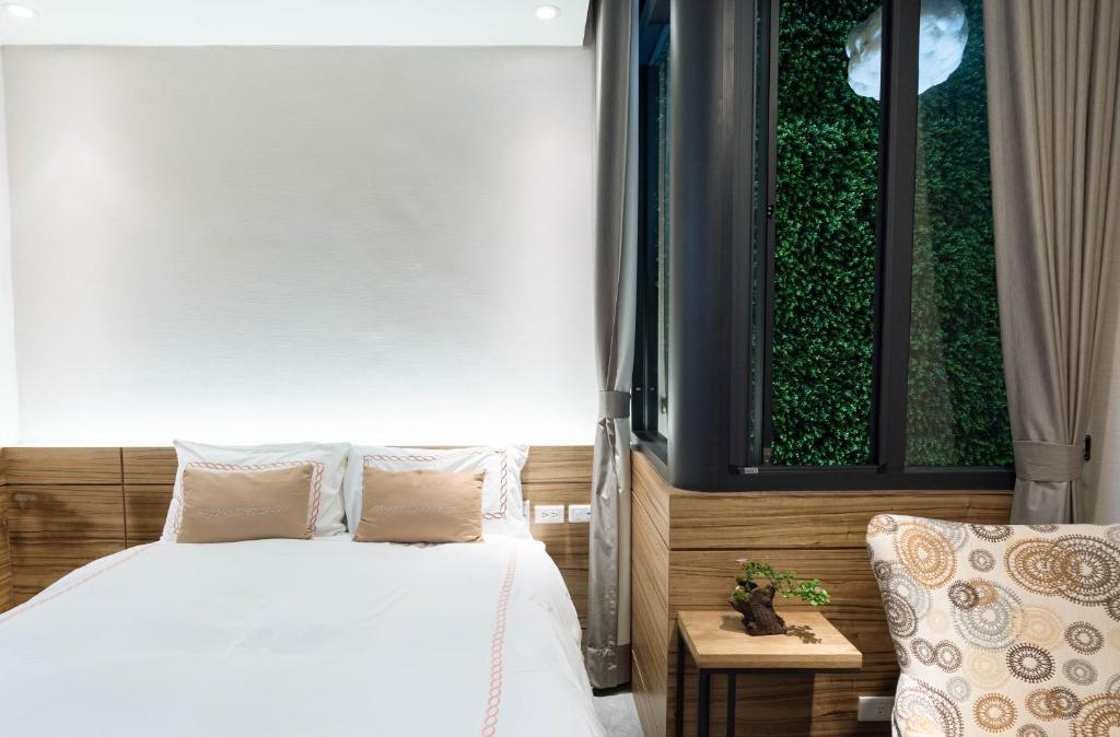 Postel nebo postele na pokoji v ubytování Tianli Hotel