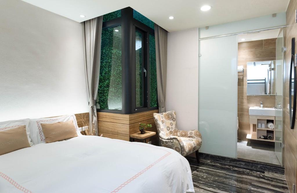Postel nebo postele na pokoji v ubytování Tianli Hotel