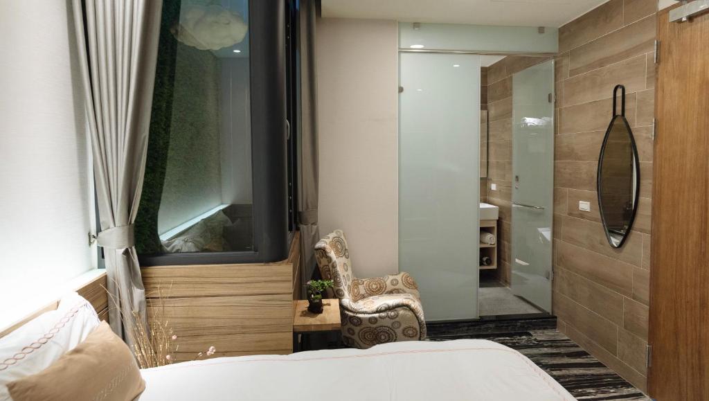 Postel nebo postele na pokoji v ubytování Tianli Hotel