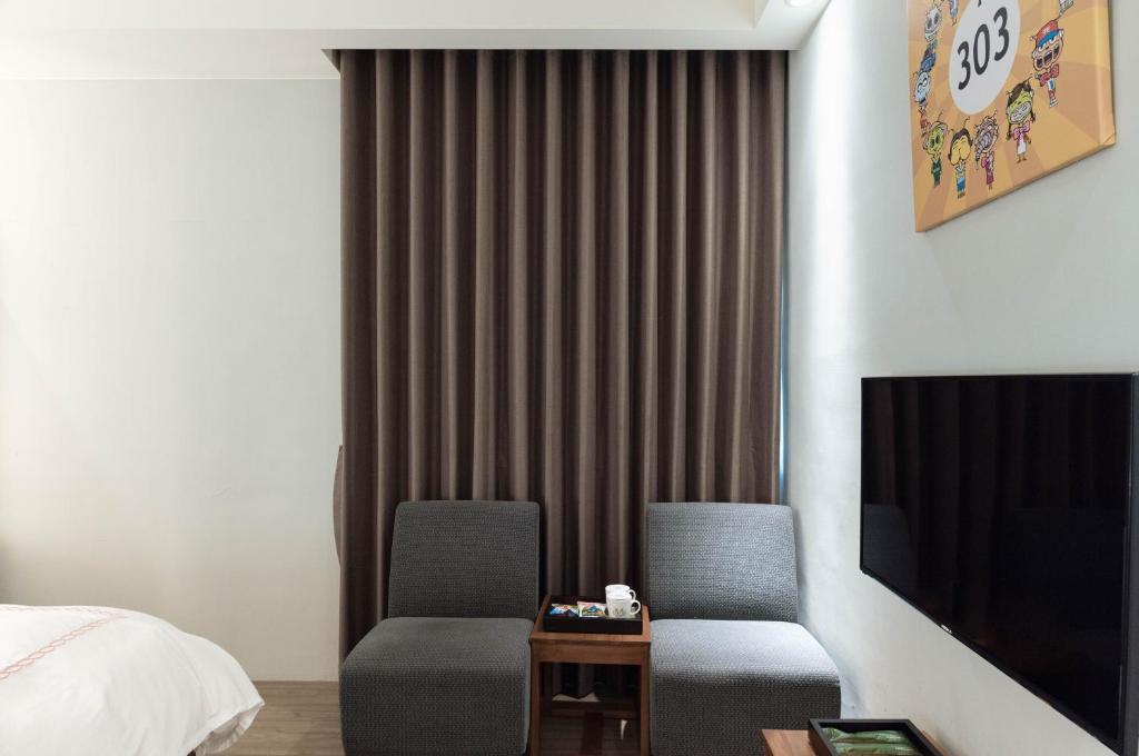 TV a/nebo společenská místnost v ubytování Tianli Hotel