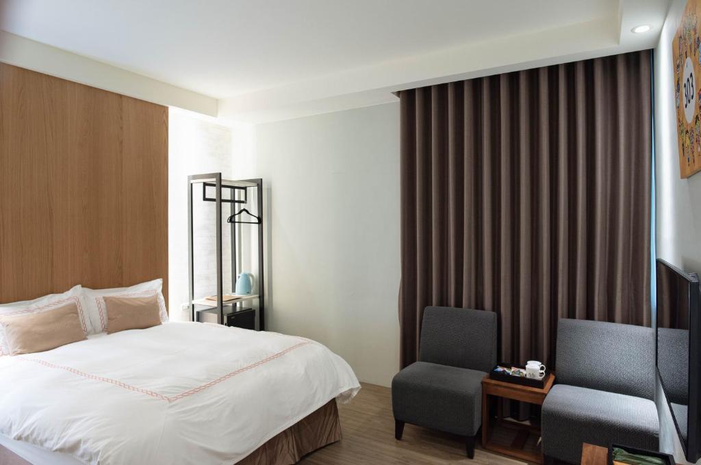 Postel nebo postele na pokoji v ubytování Tianli Hotel