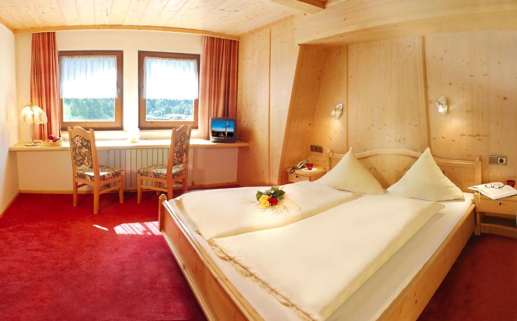 Postel nebo postele na pokoji v ubytování Hotel Eckartauerhof