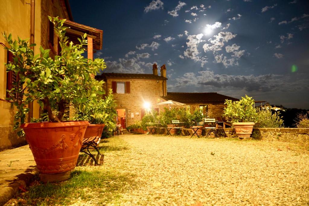 a house with a potted plant in front of it at Agriturismo La Gioconda in Vinci