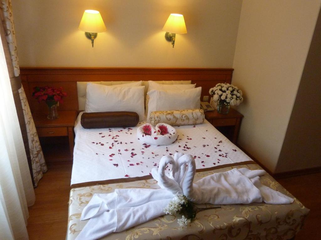 Postel nebo postele na pokoji v ubytování Prestige Hotel Old City