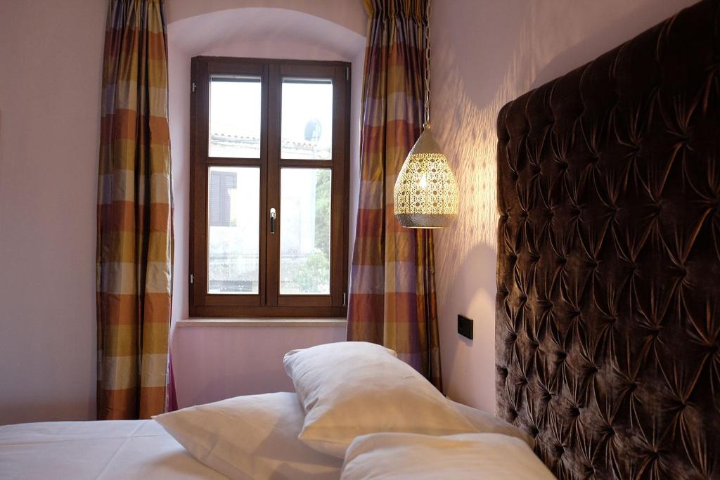 Postel nebo postele na pokoji v ubytování Foscari the fine b&b