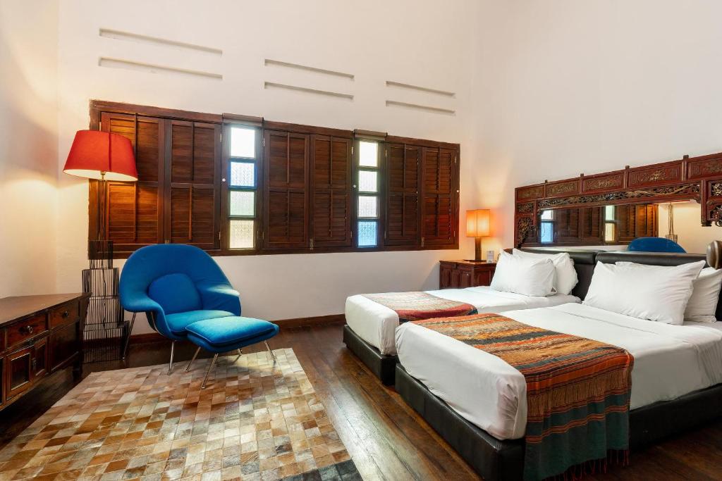 Postel nebo postele na pokoji v ubytování Hotel Penaga