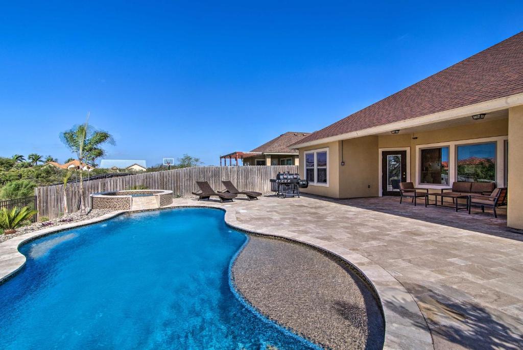 a swimming pool in the backyard of a house at South Padre Paradise with Saltwater Pool Near Golf! in Laguna Vista