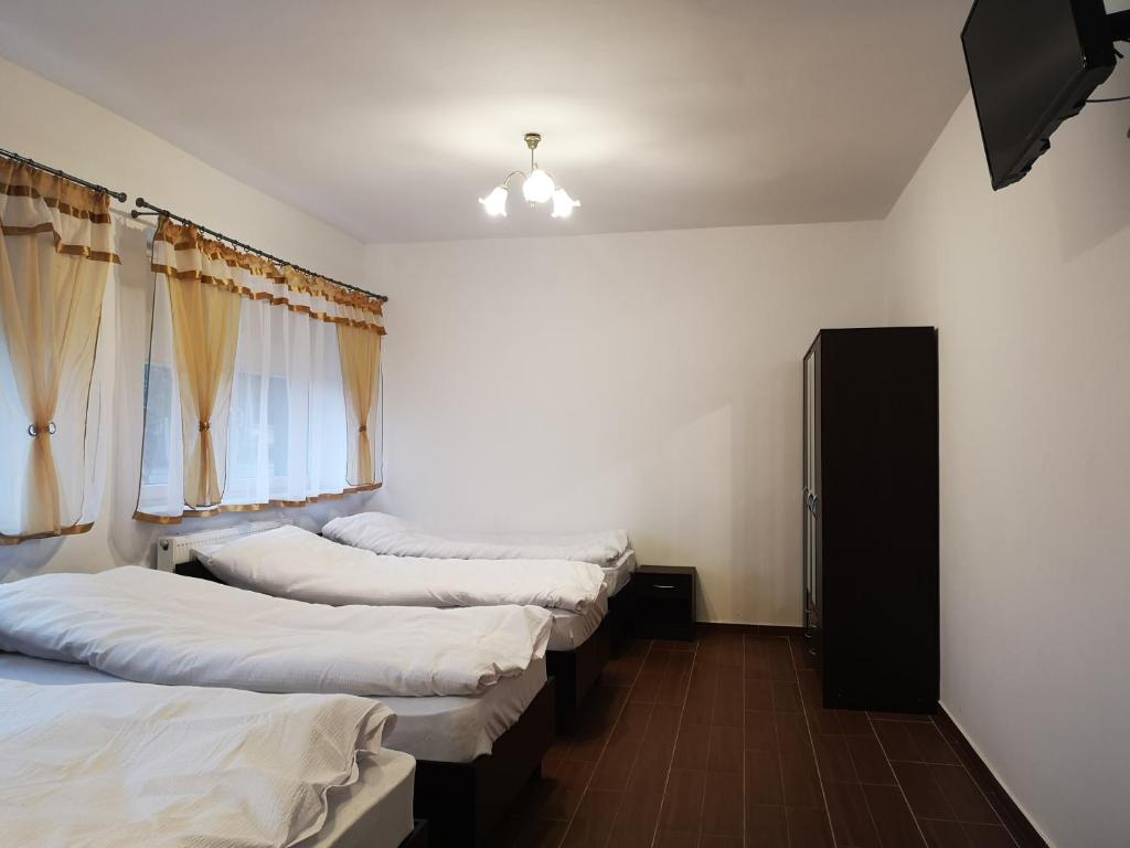 Posteľ alebo postele v izbe v ubytovaní Pokoje o wysokim standardzie