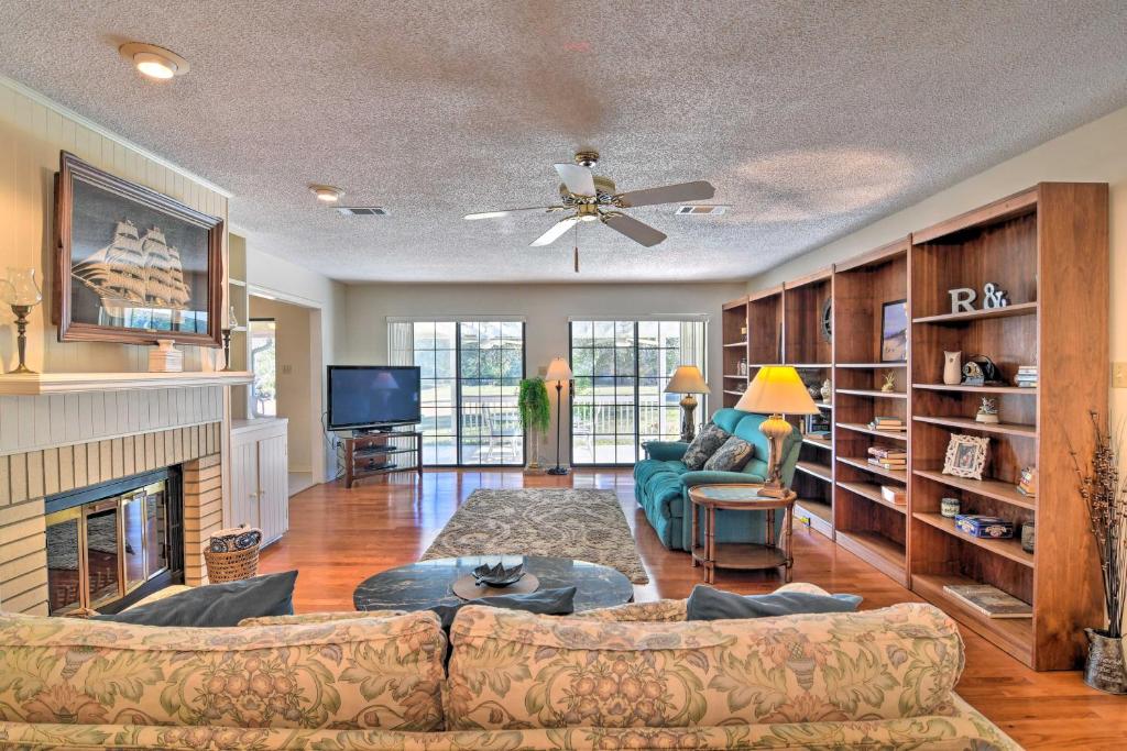a living room with a couch and a fireplace at Diamondhead Home Near Bay St LouisandBeach Blvd in Diamondhead