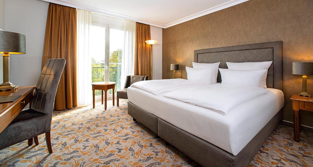 Postel nebo postele na pokoji v ubytování Victor's Residenz-Hotel Berlin Mitte