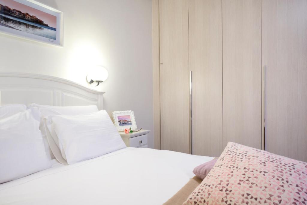 Postel nebo postele na pokoji v ubytování Casa Del Porto