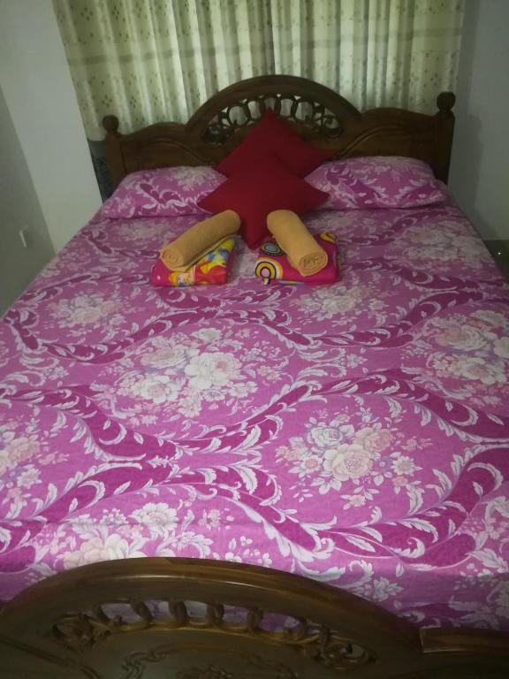 Postel nebo postele na pokoji v ubytování Anura Home Stay