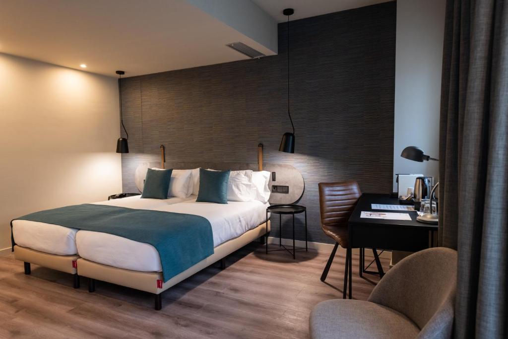 Cama o camas de una habitación en Atenea Rekord Suites
