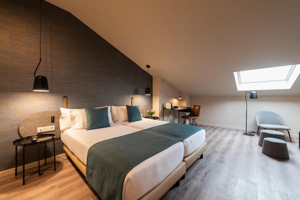 Posteľ alebo postele v izbe v ubytovaní Atenea Rekord Suites