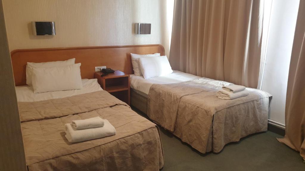 Postel nebo postele na pokoji v ubytování Hotel Bellevue