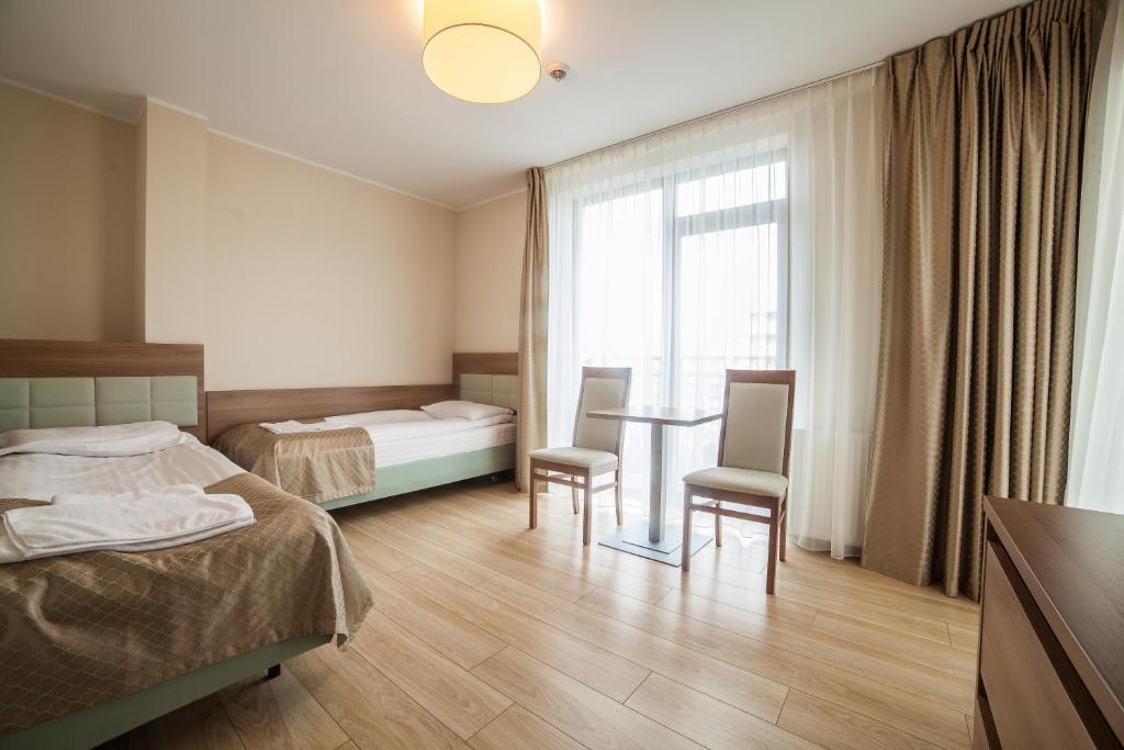 Postel nebo postele na pokoji v ubytování Olymp 3