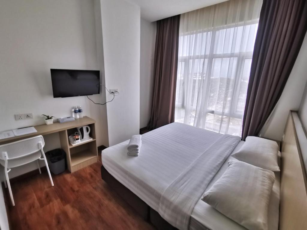 Postel nebo postele na pokoji v ubytování Green World Hotel
