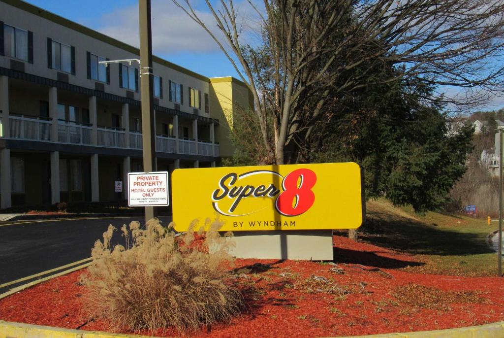 a super sign in front of a building at Super 8 by Wyndham New Cumberland in New Cumberland