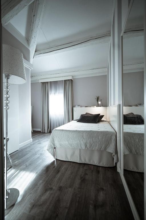Postel nebo postele na pokoji v ubytování Bonotto Hotel Belvedere