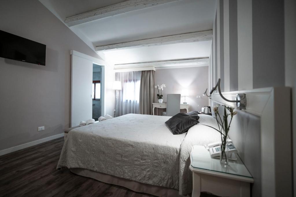 Postel nebo postele na pokoji v ubytování Bonotto Hotel Belvedere