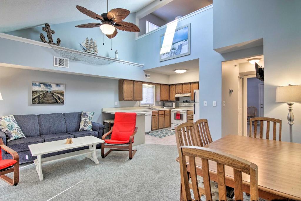 a living room with a couch and a table at half Mi to Maryland Beach Family Condo with Balcony in Ocean City