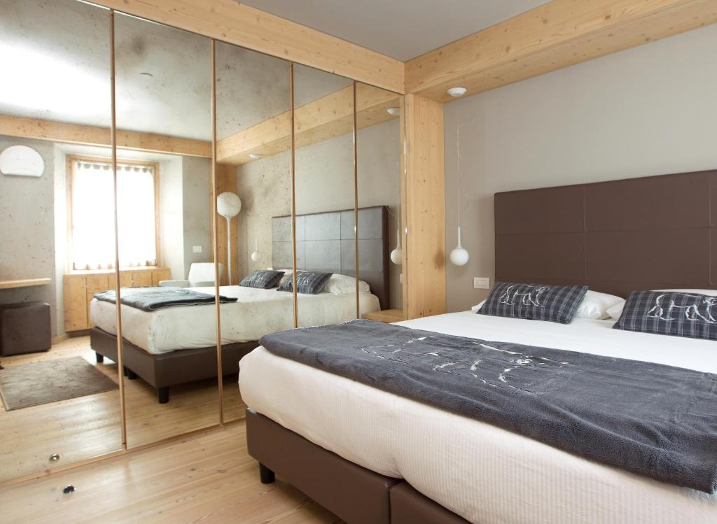 Postel nebo postele na pokoji v ubytování Hotel San Lorenzo