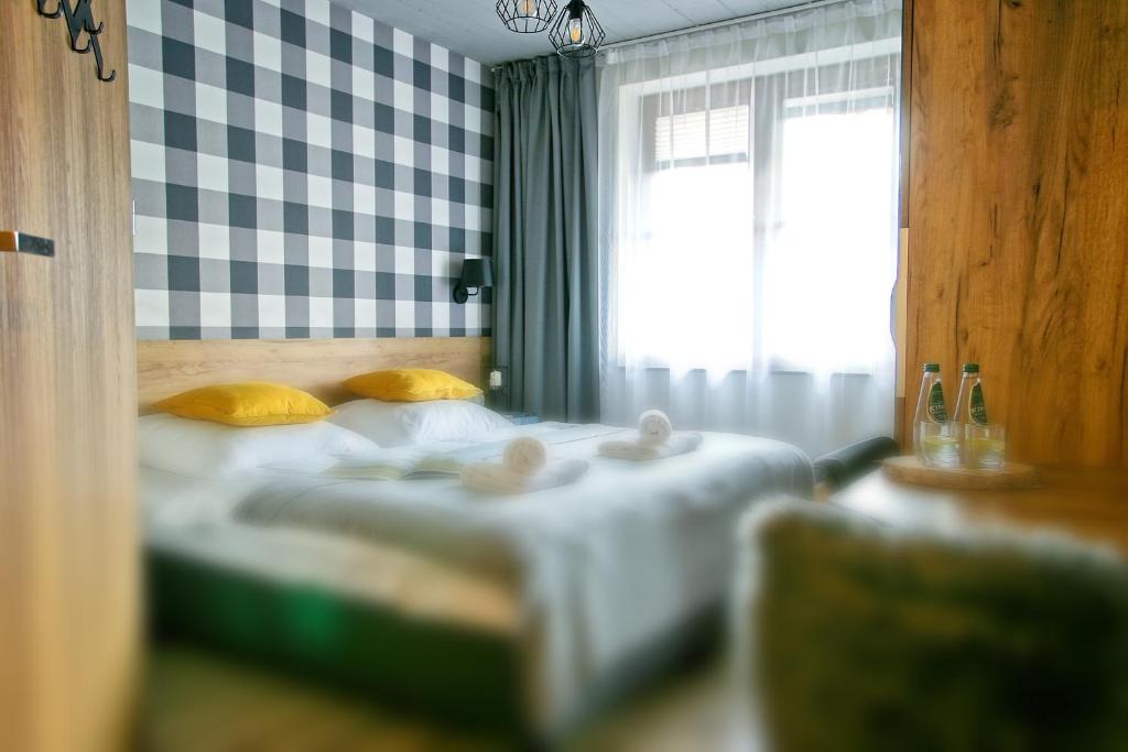 Postel nebo postele na pokoji v ubytování Apartamenty Magia Gór