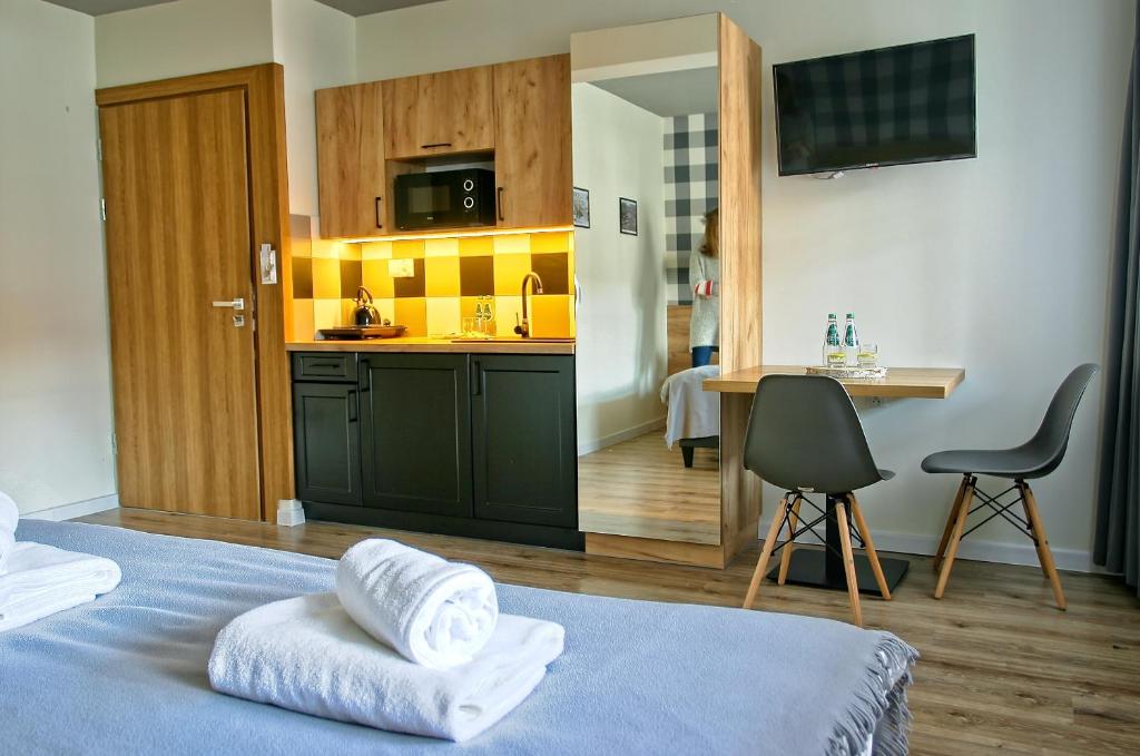 Postel nebo postele na pokoji v ubytování Apartamenty Magia Gór