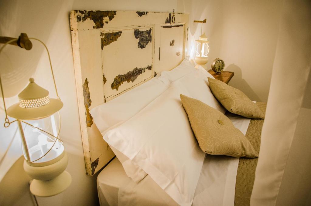 Postel nebo postele na pokoji v ubytování Trulli Holiday Albergo Diffuso