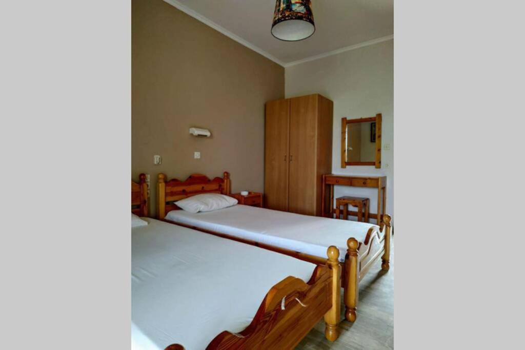 A bed or beds in a room at Rose Garden