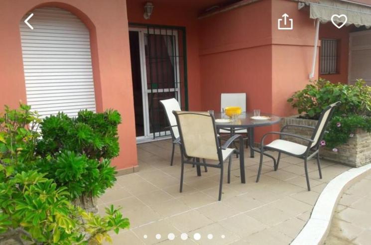 a table and chairs sitting on a patio at Rinconcito Roteńo in Rota