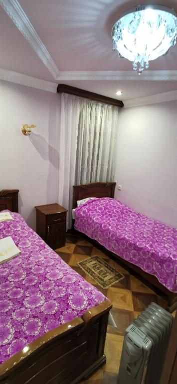 Postel nebo postele na pokoji v ubytování Hotel Halidzor