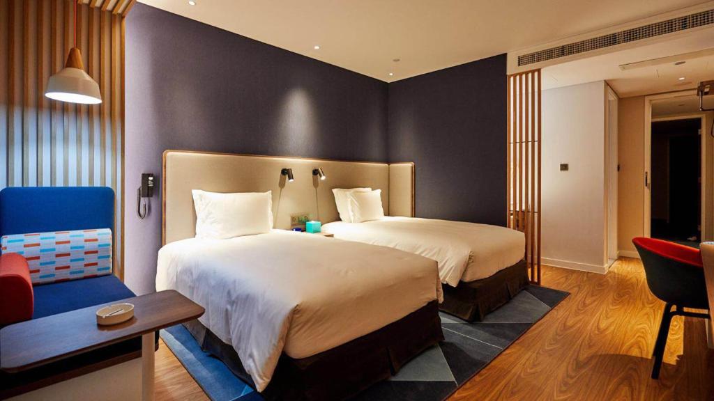 Postel nebo postele na pokoji v ubytování Holiday Inn Express Shijiazhuang High-tech Zone by IHG