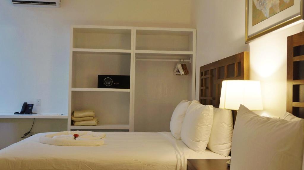 Postel nebo postele na pokoji v ubytování La Placita Inn