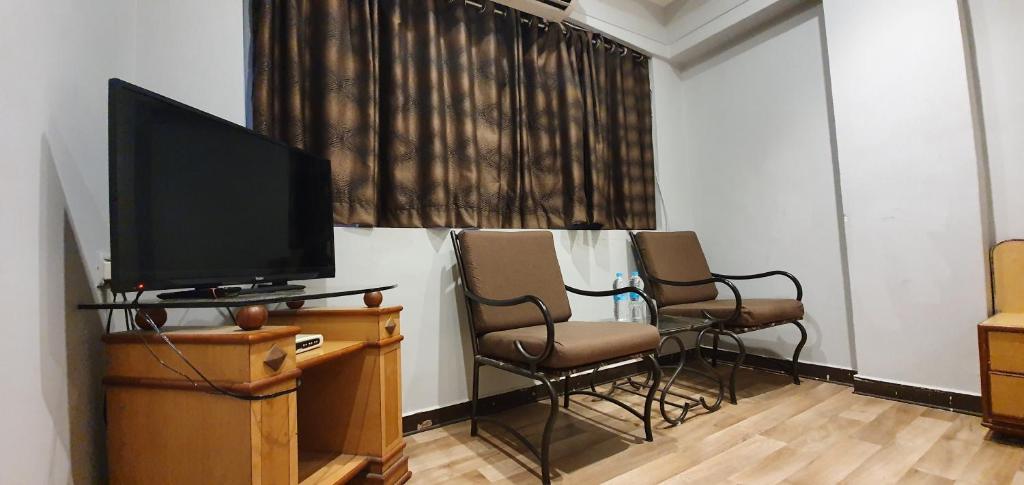 TV a/nebo společenská místnost v ubytování Hotel JMC Group