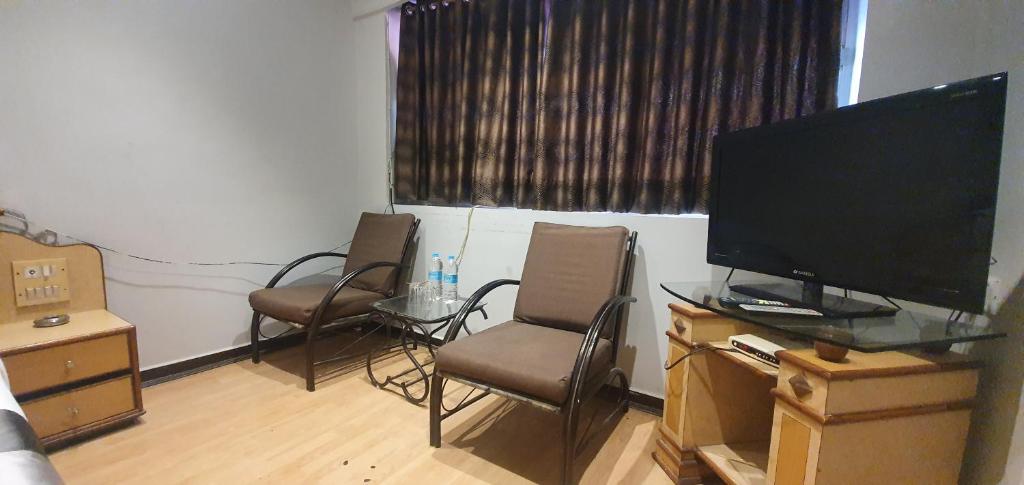 TV a/nebo společenská místnost v ubytování Hotel JMC Group
