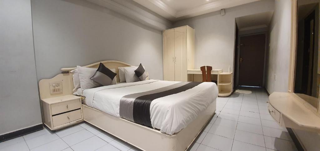 Postel nebo postele na pokoji v ubytování Hotel JMC Group