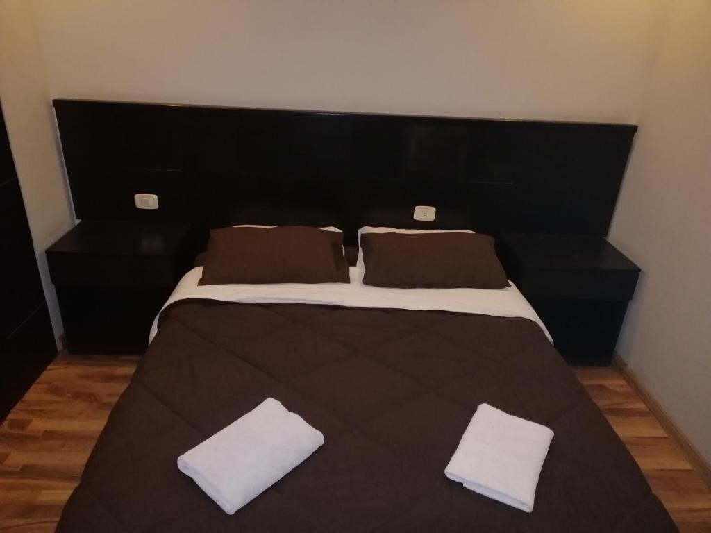 Postel nebo postele na pokoji v ubytování Madaba Hotel
