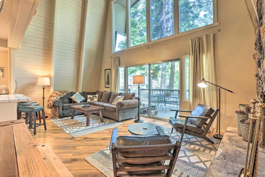 a living room filled with furniture and a large window at Near Skiing and Hiking Carnelian Bay Cabin in Carnelian Bay