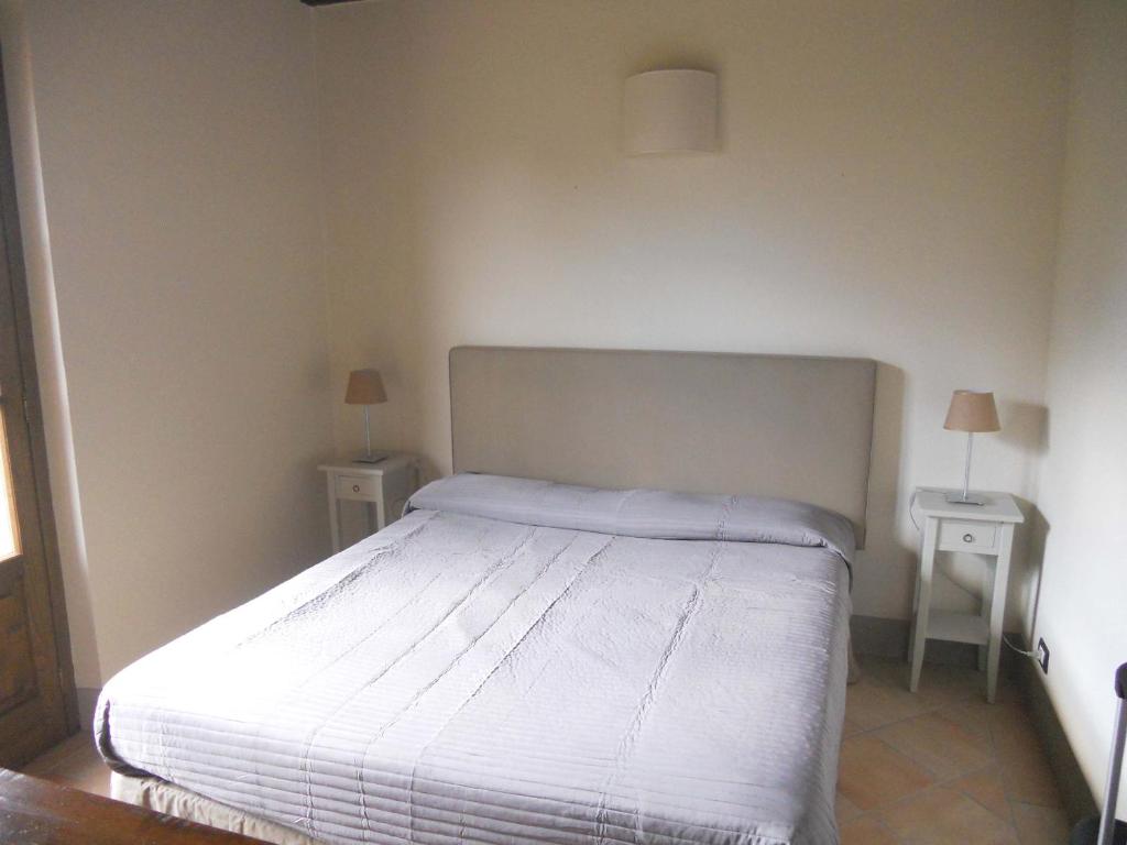 Posteľ alebo postele v izbe v ubytovaní L'Orangerie