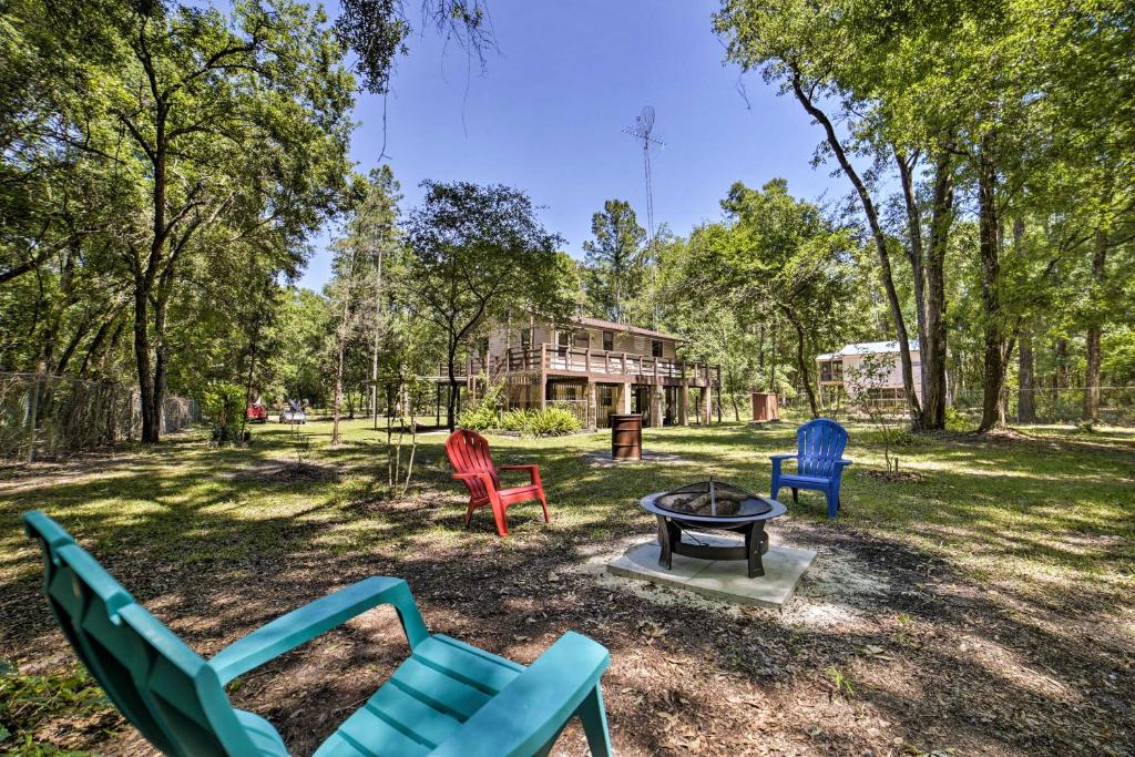 a group of chairs sitting around a table in a park at OBrien Home on about 1 Acre with Fire Pit - Near River! in O'Brien
