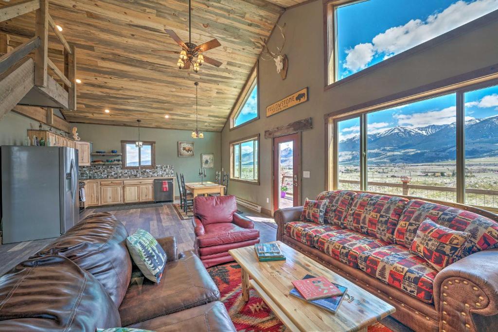 a living room with a couch and a table at Mtn-View Cabin 40 Mi to Yellowstone Ntl Park! in Livingston