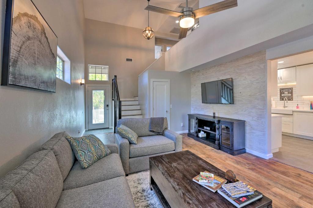 a living room with a couch and a fireplace at Modern Flagstaff Home with BBQ, Walk Downtown! in Flagstaff