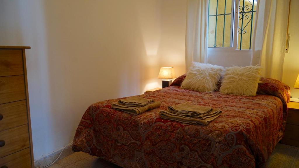 Postel nebo postele na pokoji v ubytování Casa Esperanza Pedregalejo