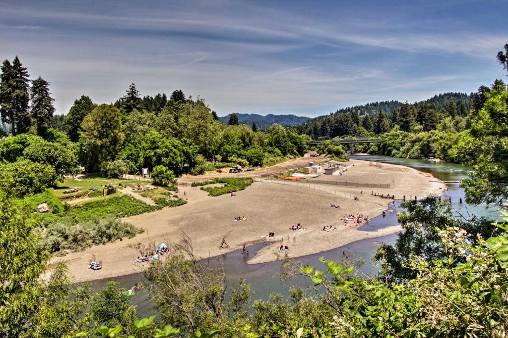 a view of a river with people on the beach at Guerneville Home - Walk to the Russian River! in Guerneville