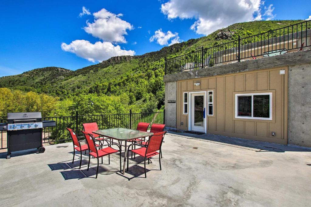 a patio with a table and chairs and a grill at Lava Hot Springs Studio 4-Min Walk to Pools! in Lava Hot Springs