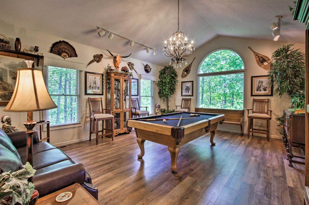 a living room with a pool table in it at Eclectic Cabin with Hot Tub 1 Mi to Ober Gatlinburg in Gatlinburg