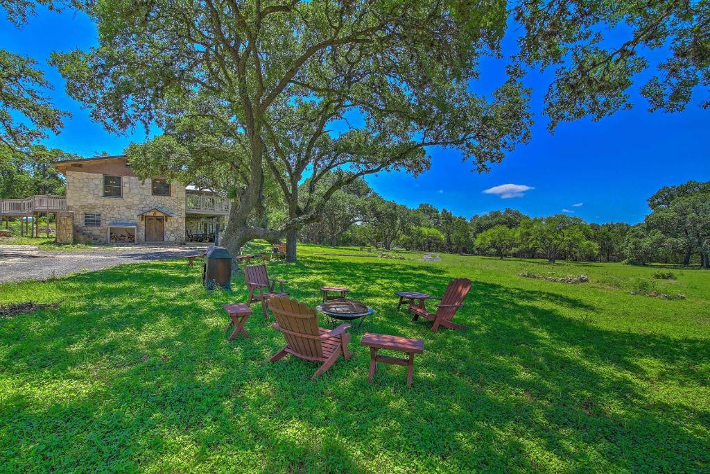 a group of chairs and a table in a park at Scenic Cottage with Views, 17 mi to San Antonio! in San Antonio